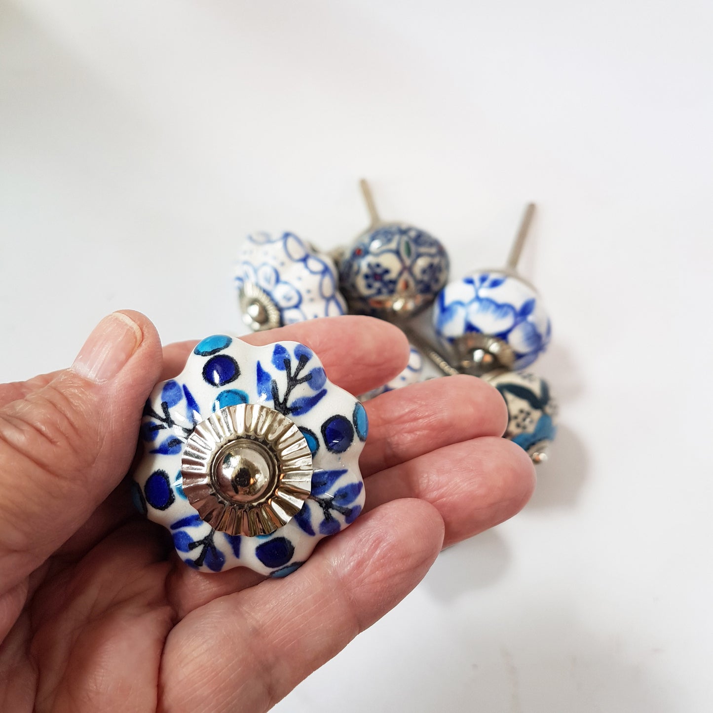 Delphine set of 8 cabinet knob drawer pulls. Designer collection in classic Delft Dutch blue & white floral patterns. Easy DIY decor fix!
