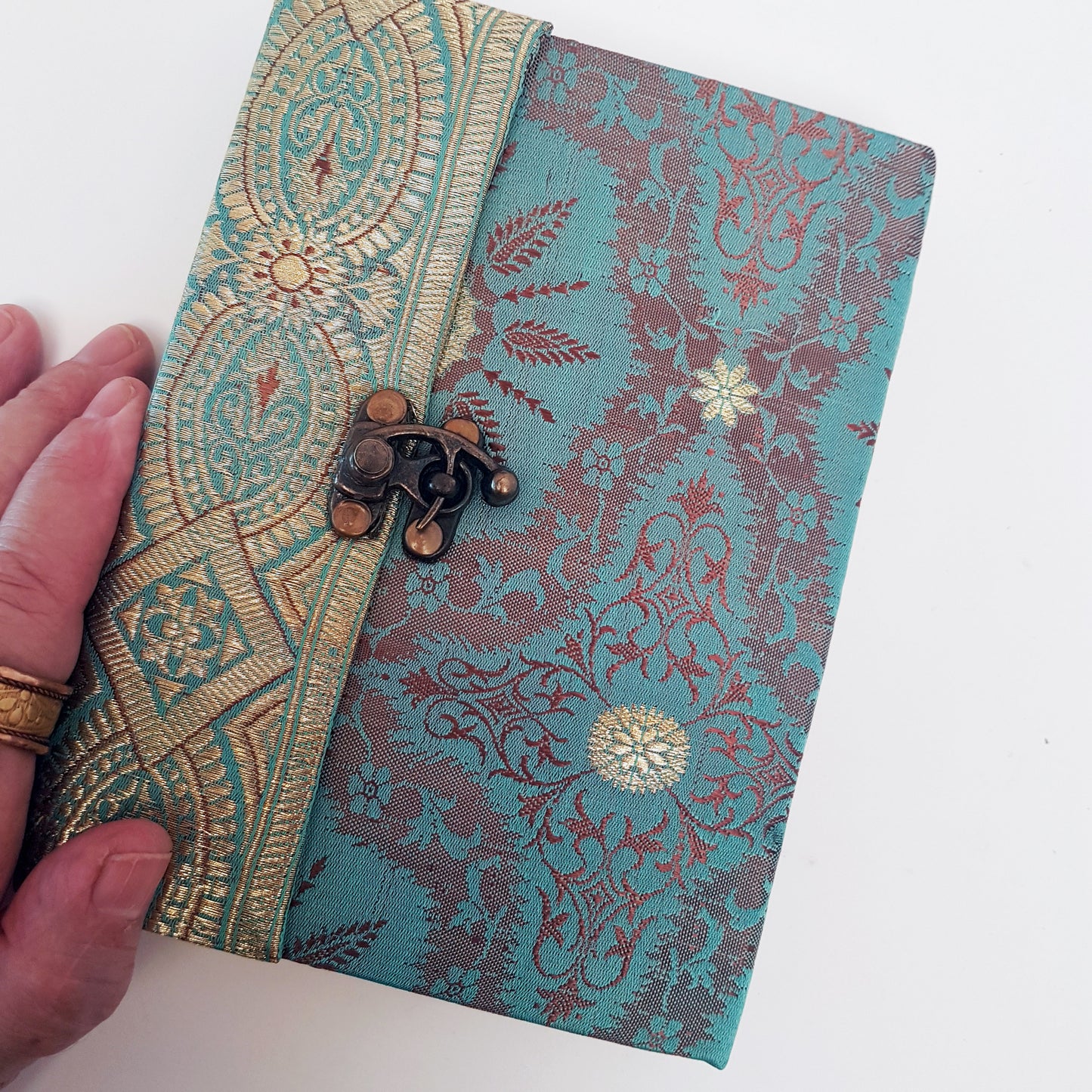 Vintage fabric cover sketchbook journal 5 by 7 inches. One of a kind blank book with premium paper pages. Medieval look bronze metal lock closure.