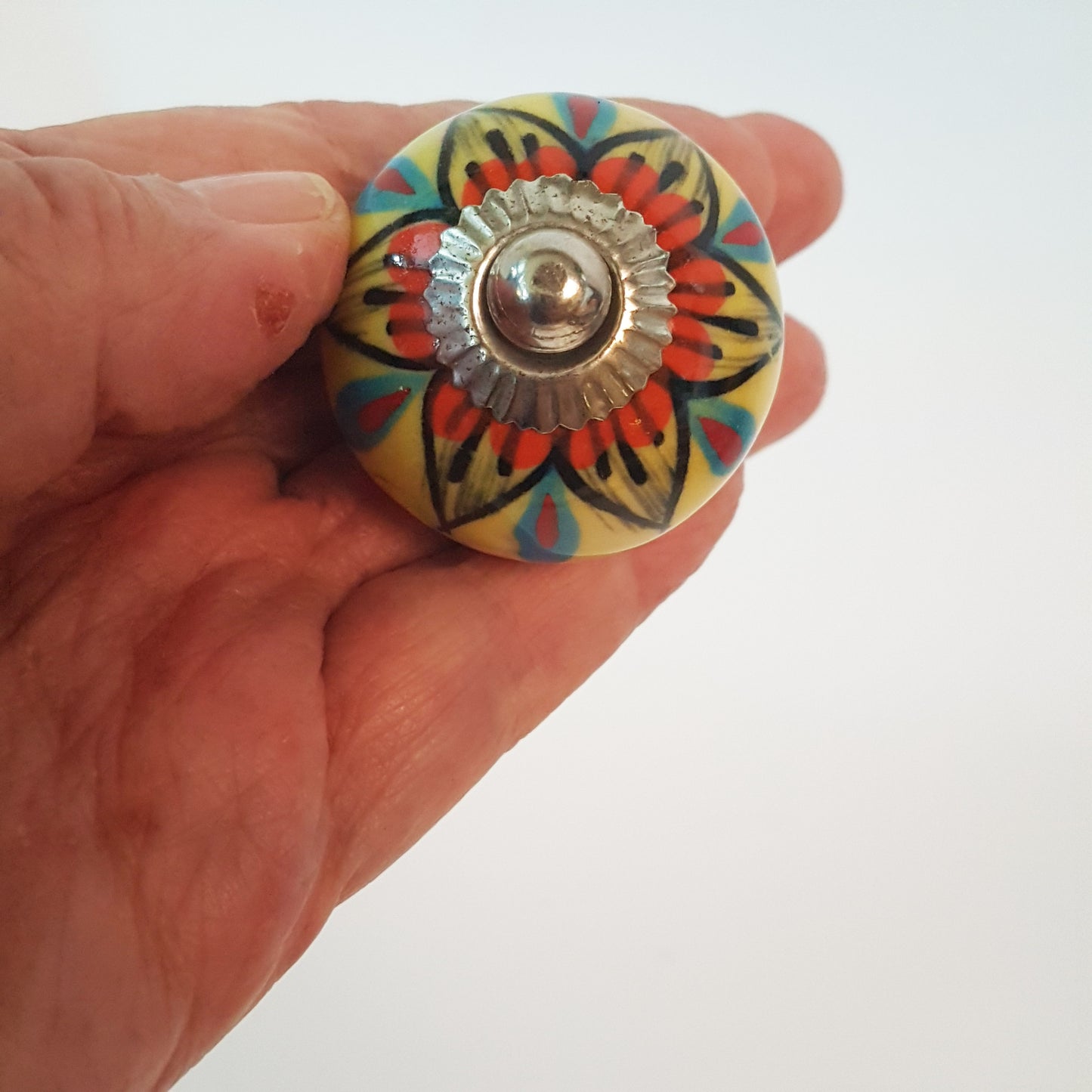 Secret Garden collection of 8 hand painted designer cupboard & drawer knobs in colorful floral patterns. Standard 1.5 inch diameter size.