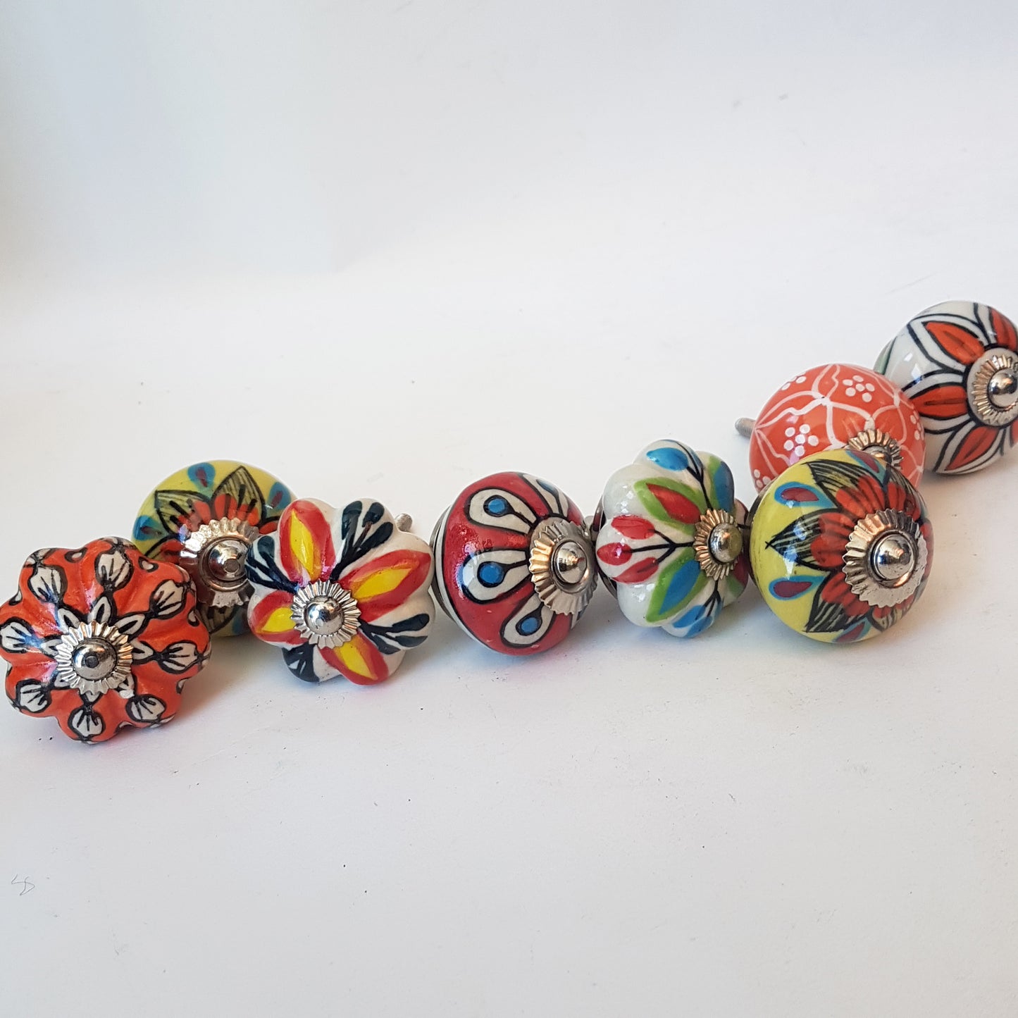 Tropicale collection of 8 designer hand painted knob pulls for cabinets and cupboards, dresser drawers. Exclusive vibrant floral designs.