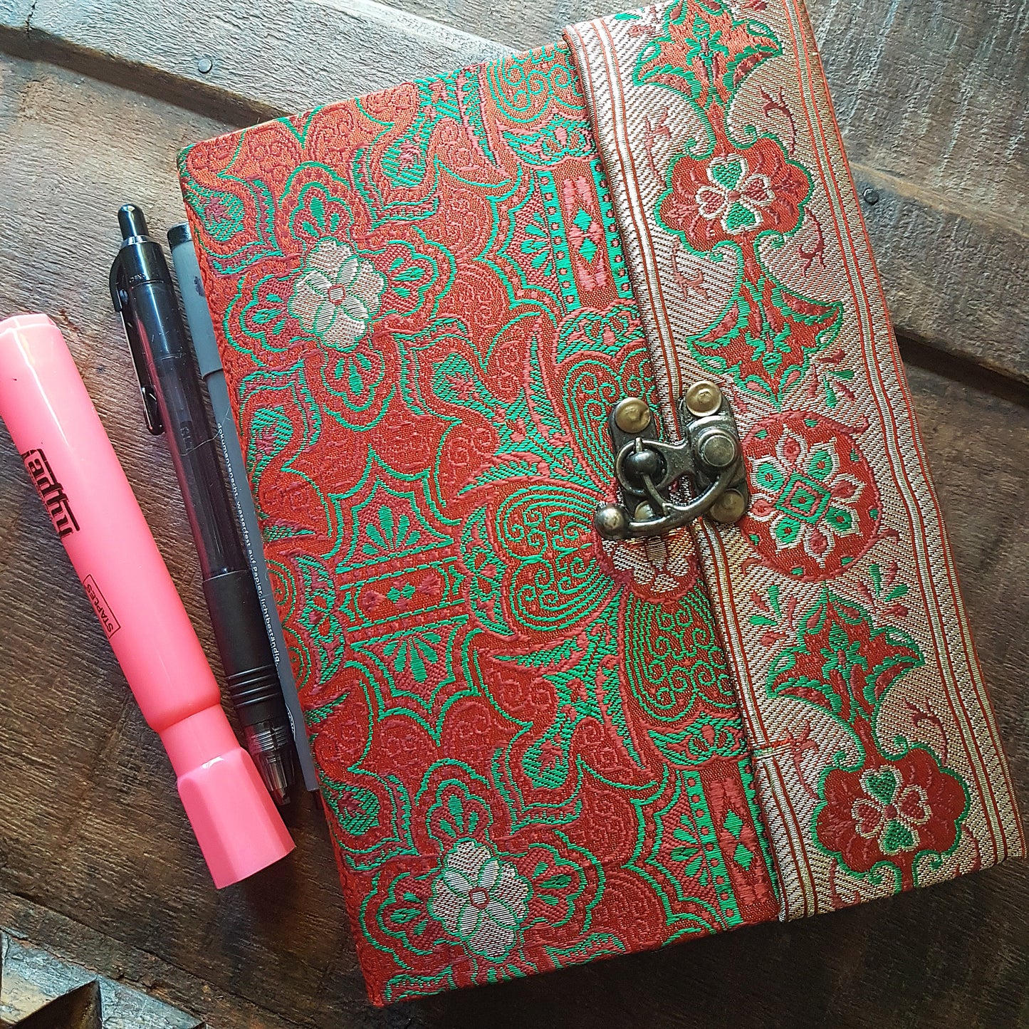 Vintage fabric sketchbook journal 5 by 7 inches. One of a kind blank book with artisan paper pages. Medieval look bronze metal lock closure.