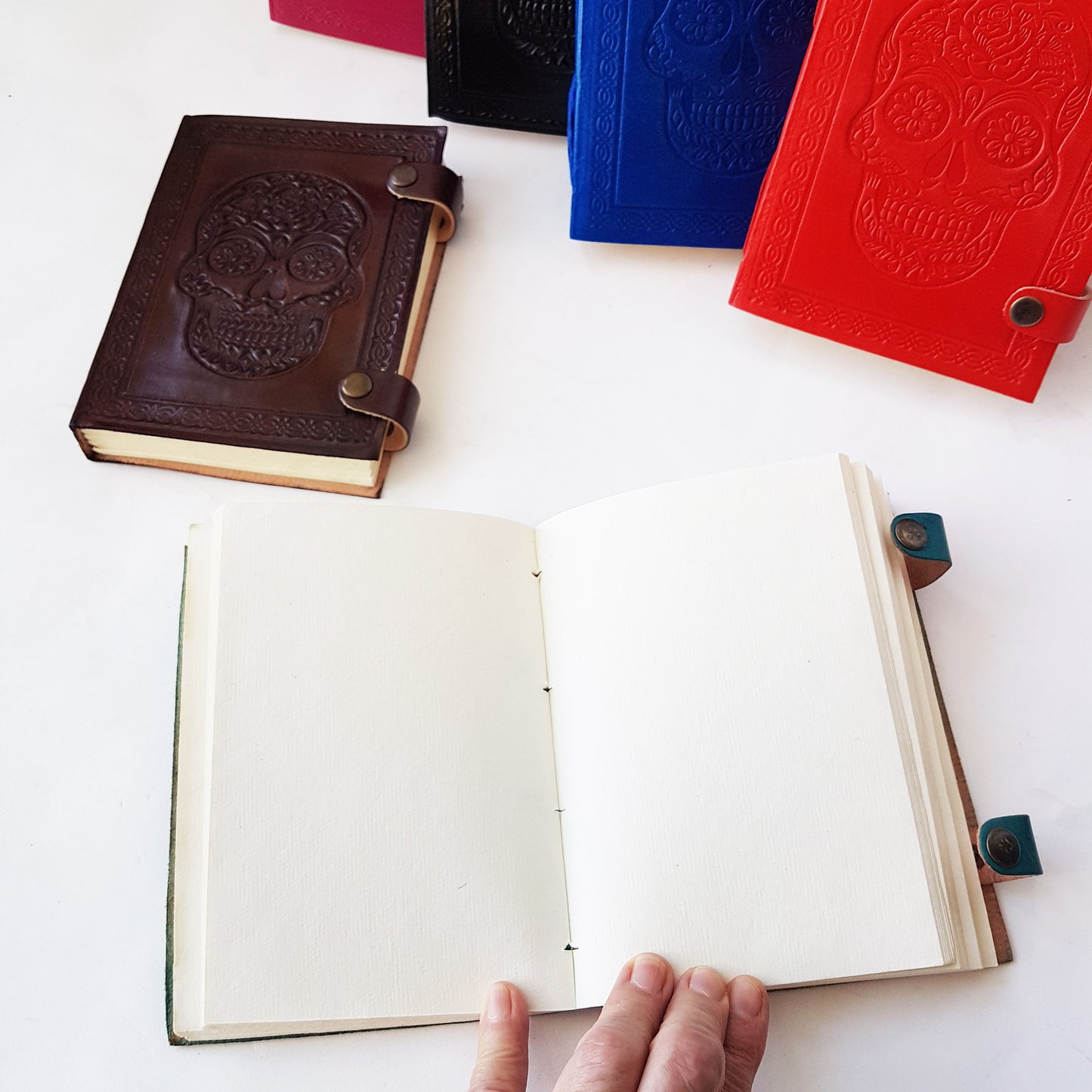 Hand bound colorful leather journal notebook. Leather grimoire with embossed skull design. Halloween Day of the dead, gothic theme diary. 4 vivid colors.