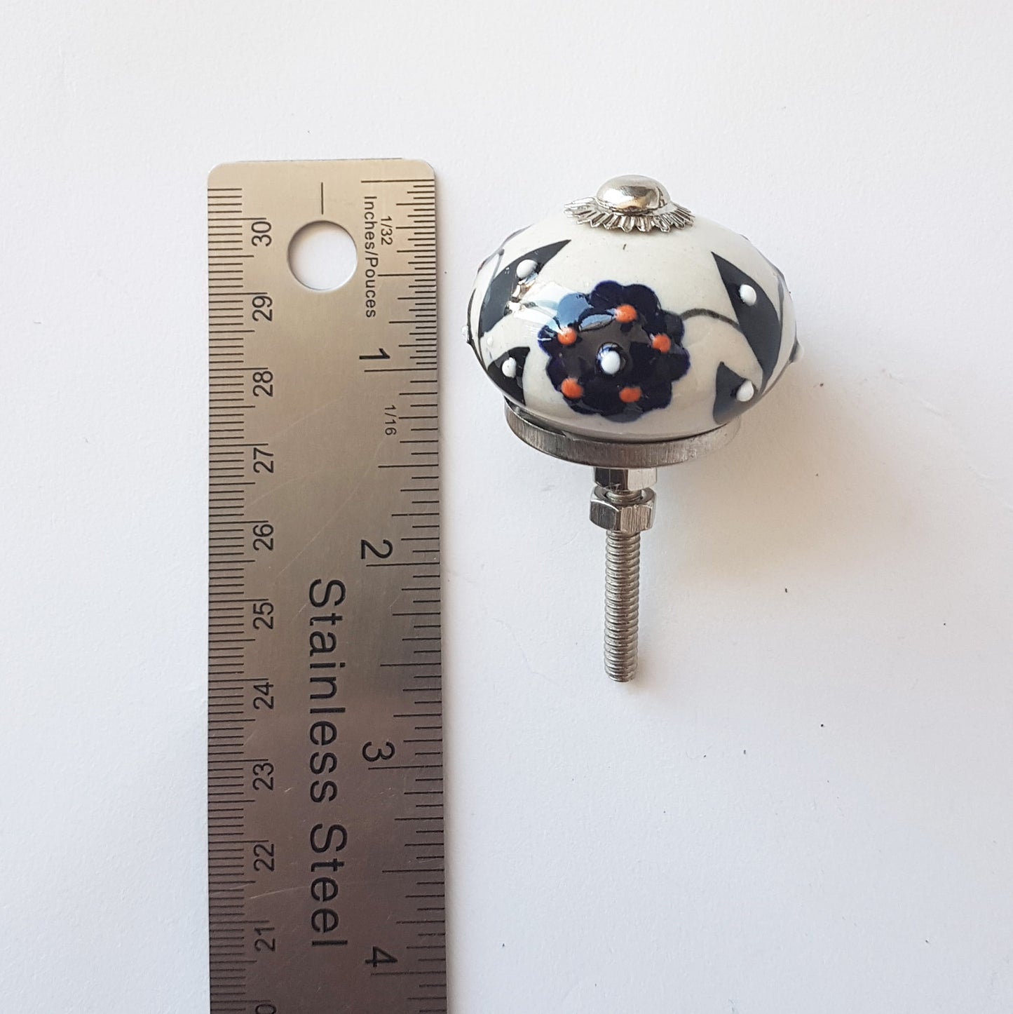 Florentine set of 6 Embossed hand painted knobs in exclusive designs. Standard 1.5 inch size.