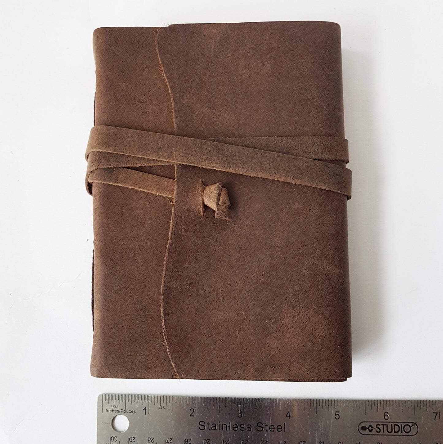 Leather bound suede diary notebook journal with vintage wrap tie closure. Rustic taupe brown suede blank book, sketch book, bullet journal.