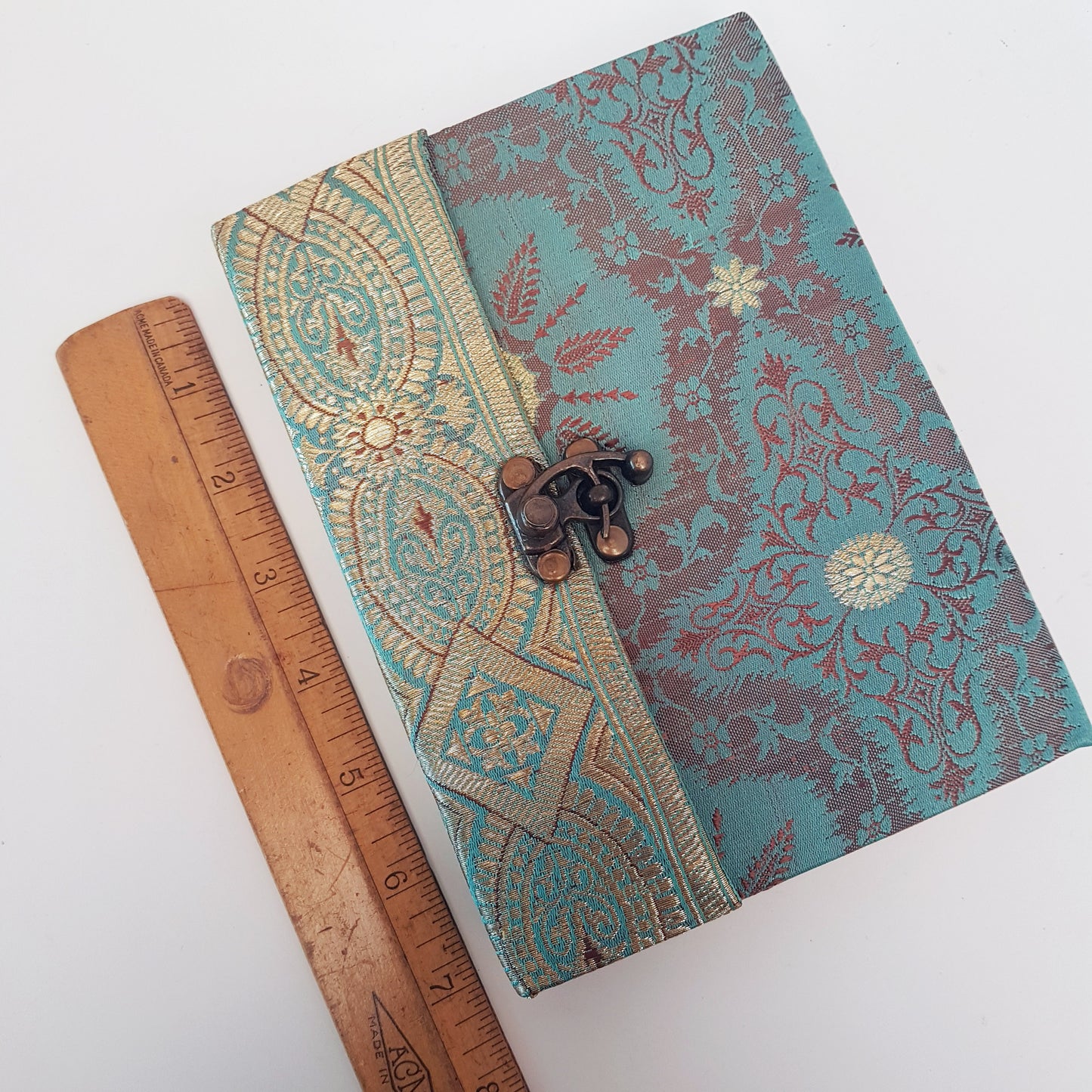 Vintage fabric cover sketchbook journal 5 by 7 inches. One of a kind blank book with premium paper pages. Medieval look bronze metal lock closure.