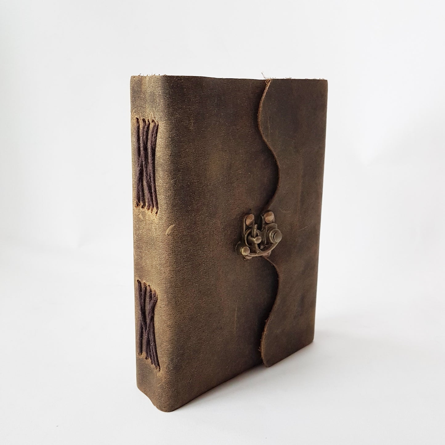 Leather bound suede diary rustic brown journal. Medieval style grimoire with bronze lock. Measures 5 by 7 inches with handmade paper pages.