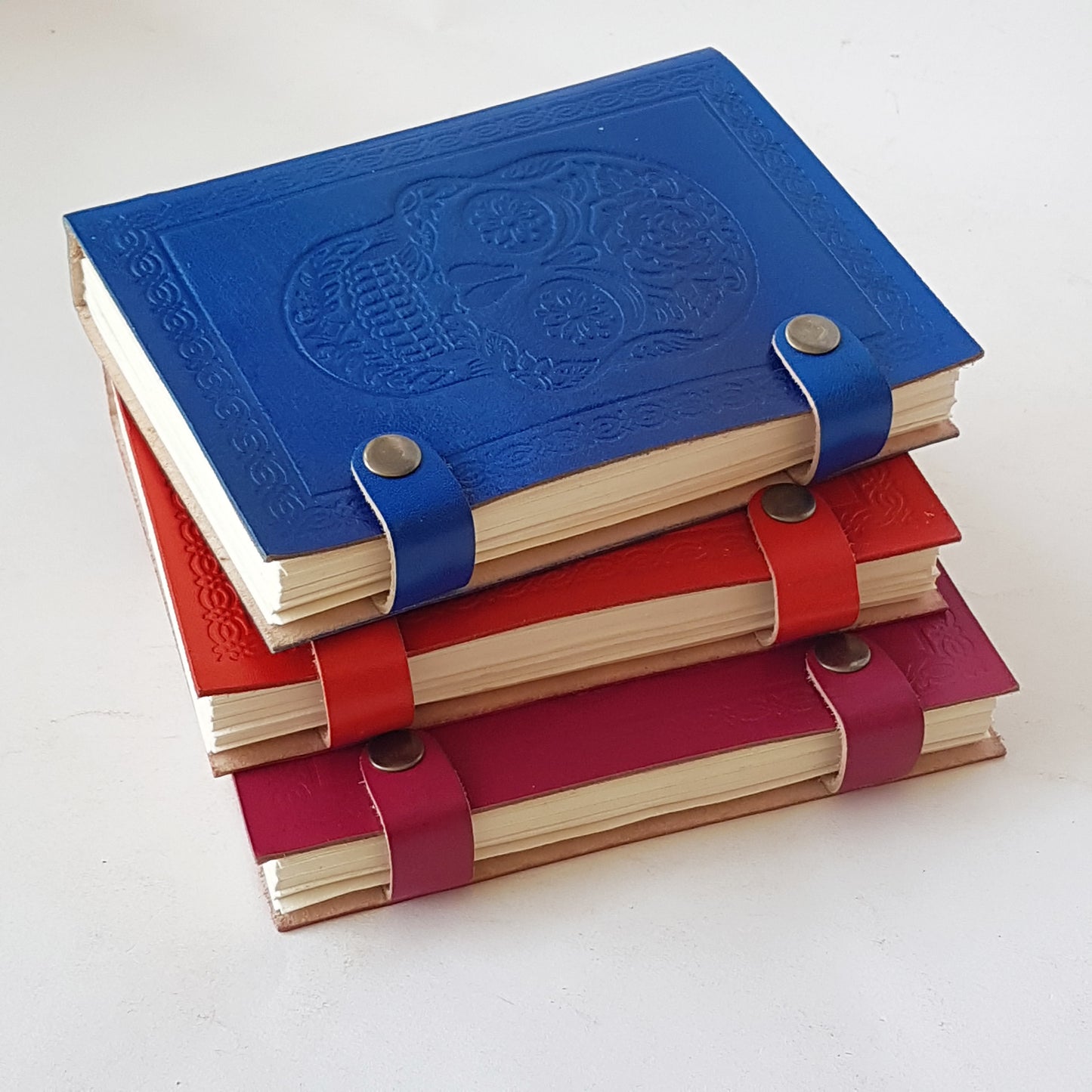 Hand bound colorful leather journal notebook. Leather grimoire with embossed skull design. Halloween Day of the dead, gothic theme diary. 4 vivid colors.