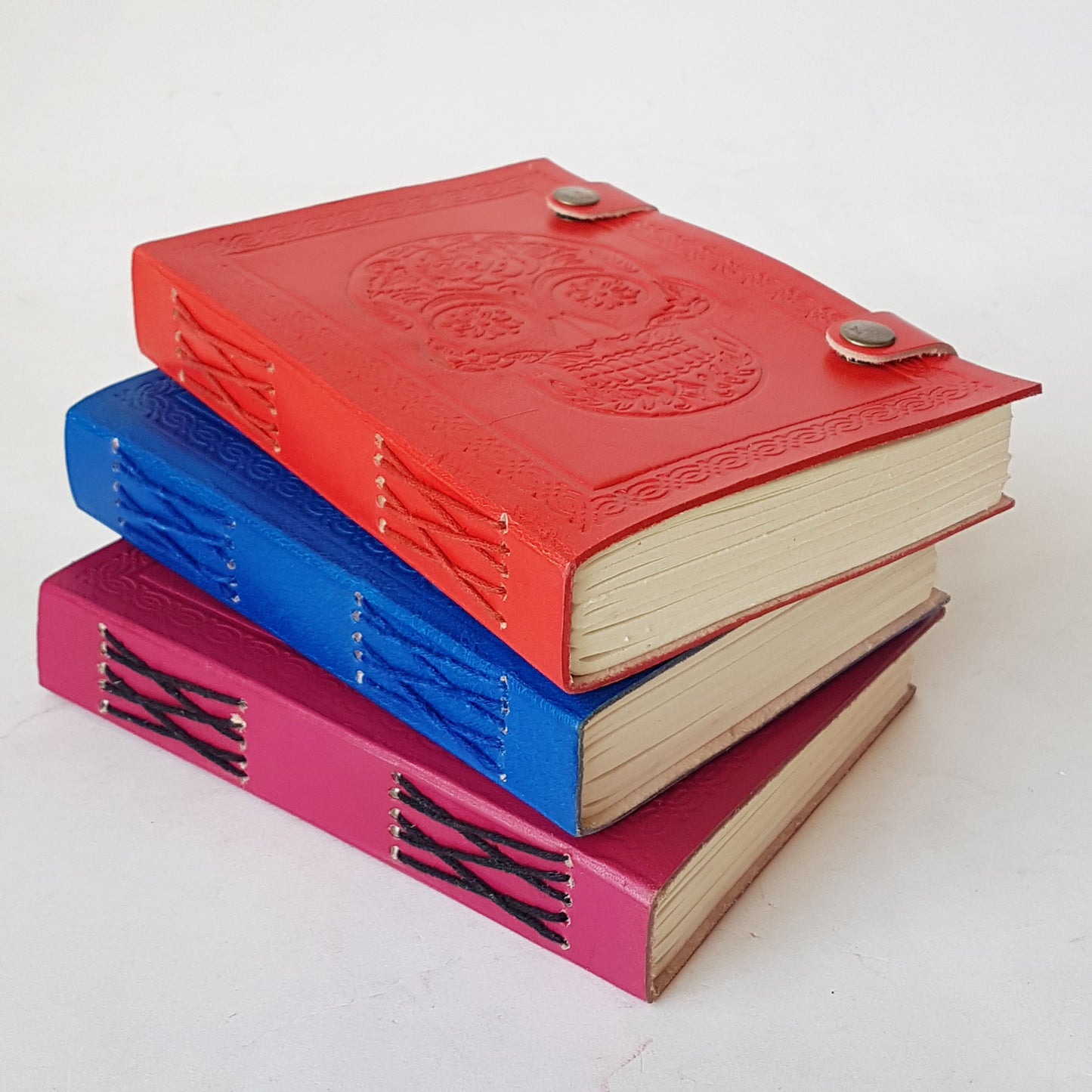 Hand bound colorful leather journal notebook. Leather grimoire with embossed skull design. Halloween Day of the dead, gothic theme diary. 4 vivid colors.