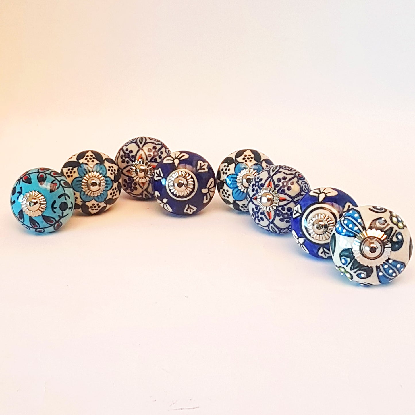 Set of 8 hand painted cabinet knob drawer pulls in vintage designs.