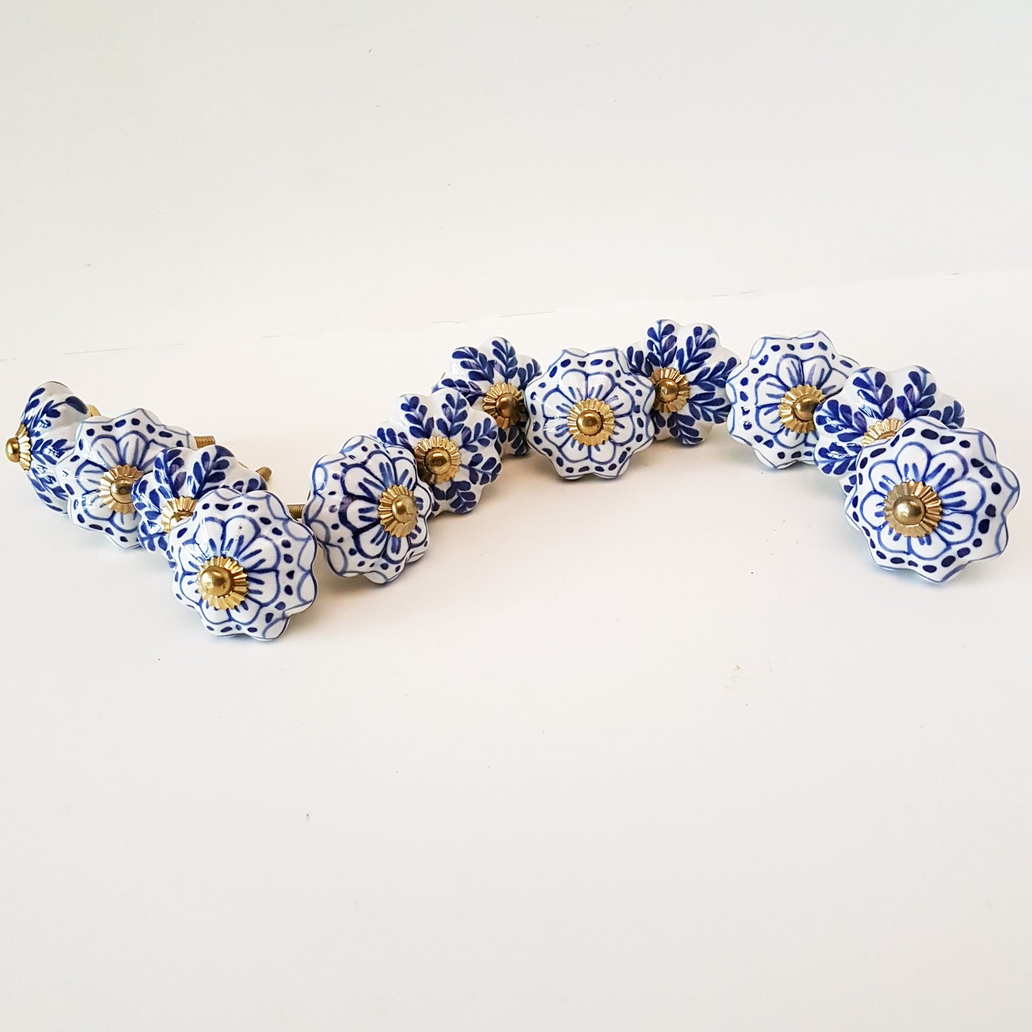 Set of 24 Delft Pattern Blue & White Cabinet Knob Drawer Pulls. Hand painted in vintage style floral patterns. Kitchen cabinet hardware.