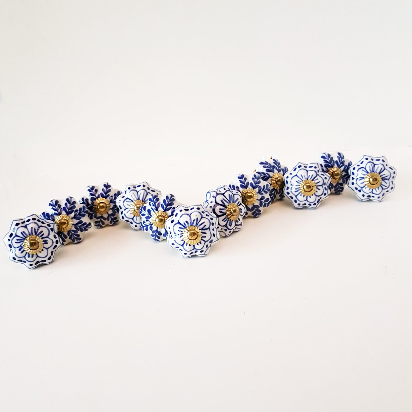 Set of 24 Delft Pattern Blue & White Cabinet Knob Drawer Pulls. Hand painted in vintage style floral patterns. Kitchen cabinet hardware.