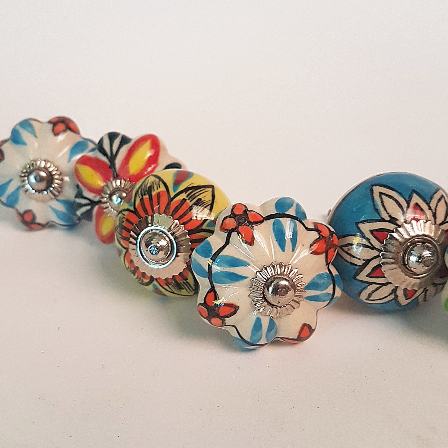 Secret Garden collection of 8 hand painted designer cupboard & drawer knobs in colorful floral patterns. Standard 1.5 inch diameter size. - Vintage India Ca