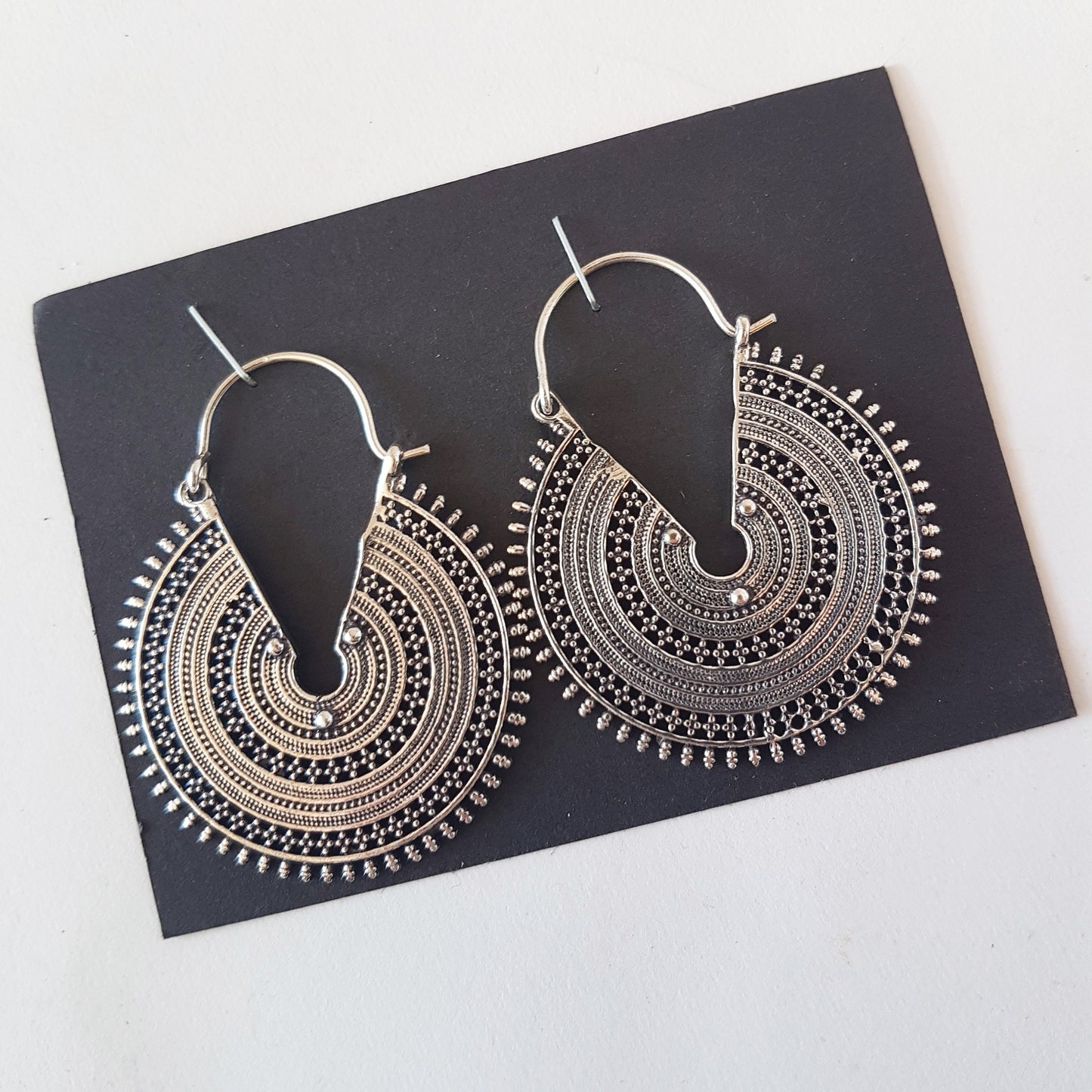 Silver filigree hanging disc earrings. Solid hoop tribal look earrings with an intricate geometric desgn. Also available in antique bronze. - Vintage India Ca