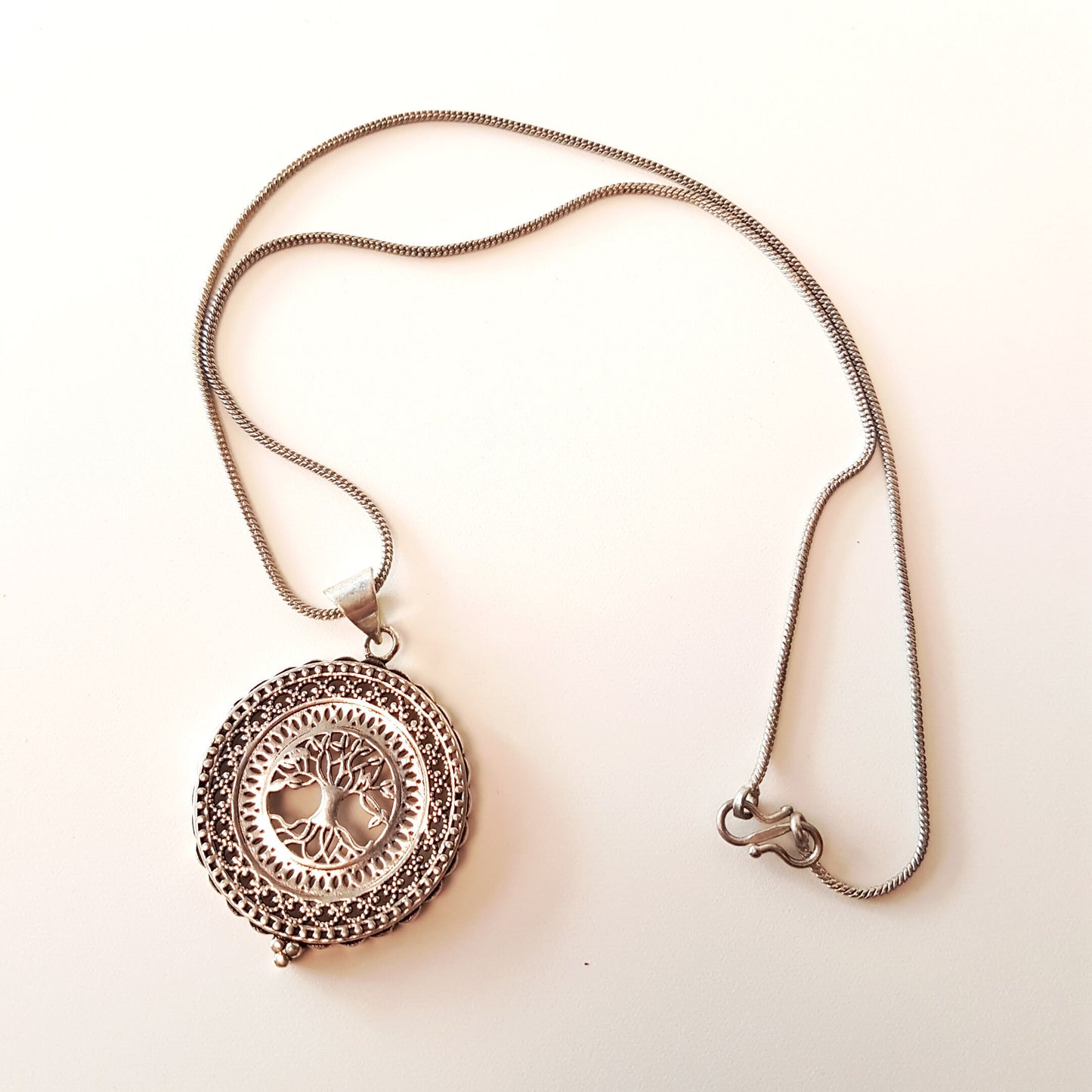 Silver filigree tree of life pendant. Engraved silver disk shape tree pendant necklace. Gender neutral design. 1.75 inch diameter on chain. - Vintage India Ca