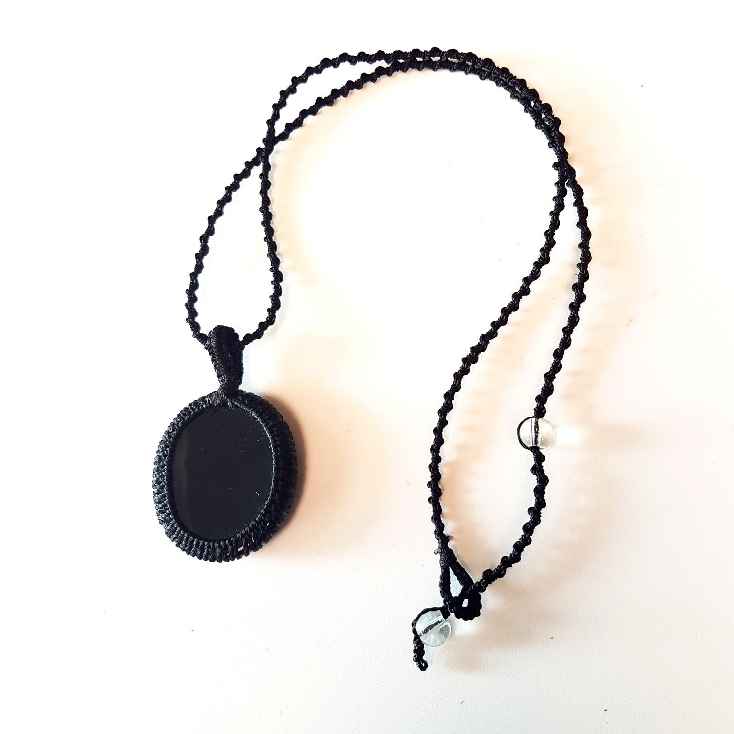 Gender neutral design black onyx pendant necklace. Hangs on a 20 inch black woven corkscrew knot cord. Adjustable length. Unisex jewelry. - Vintage India Ca