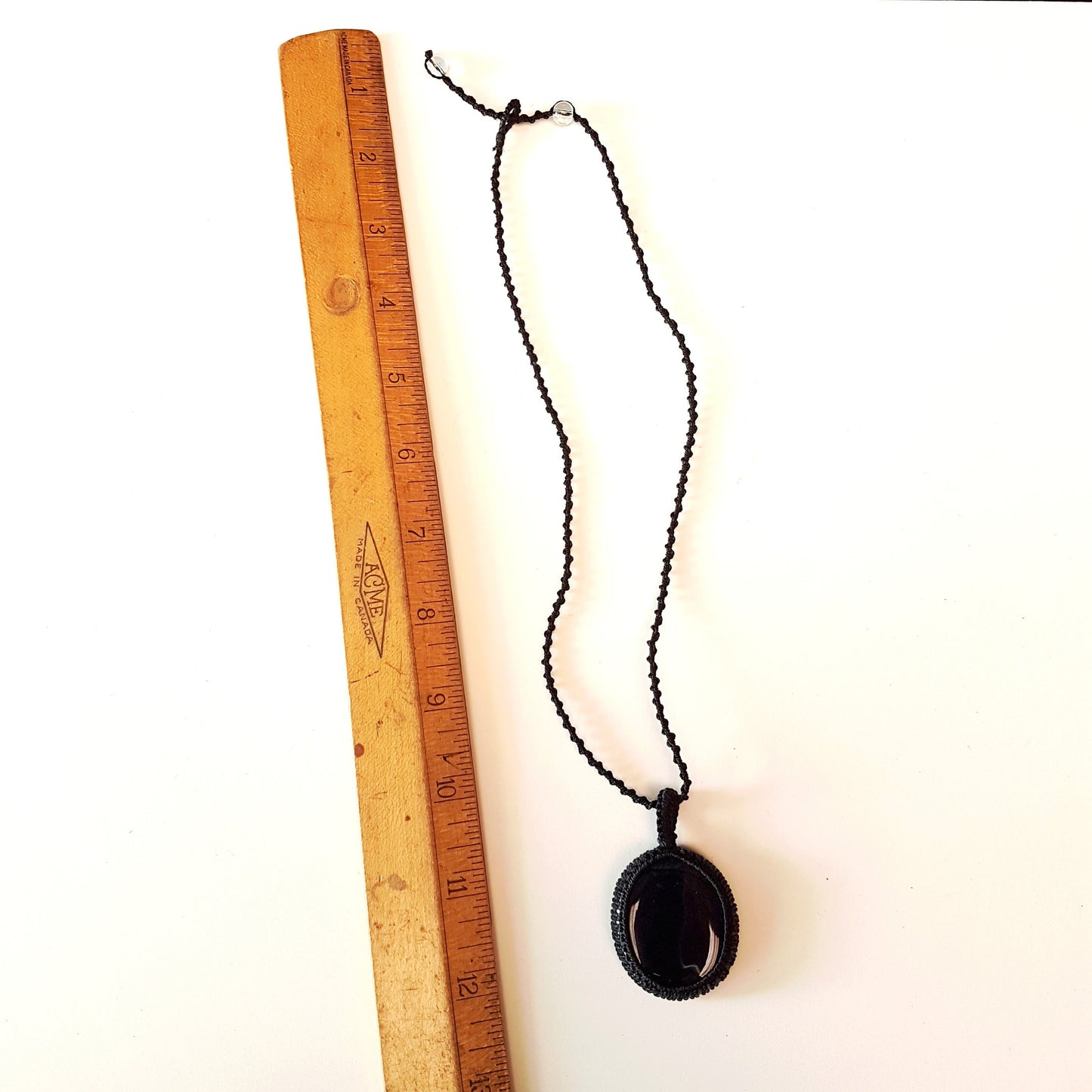 Gender neutral design black onyx pendant necklace. Hangs on a 20 inch black woven corkscrew knot cord. Adjustable length. Unisex jewelry. - Vintage India Ca
