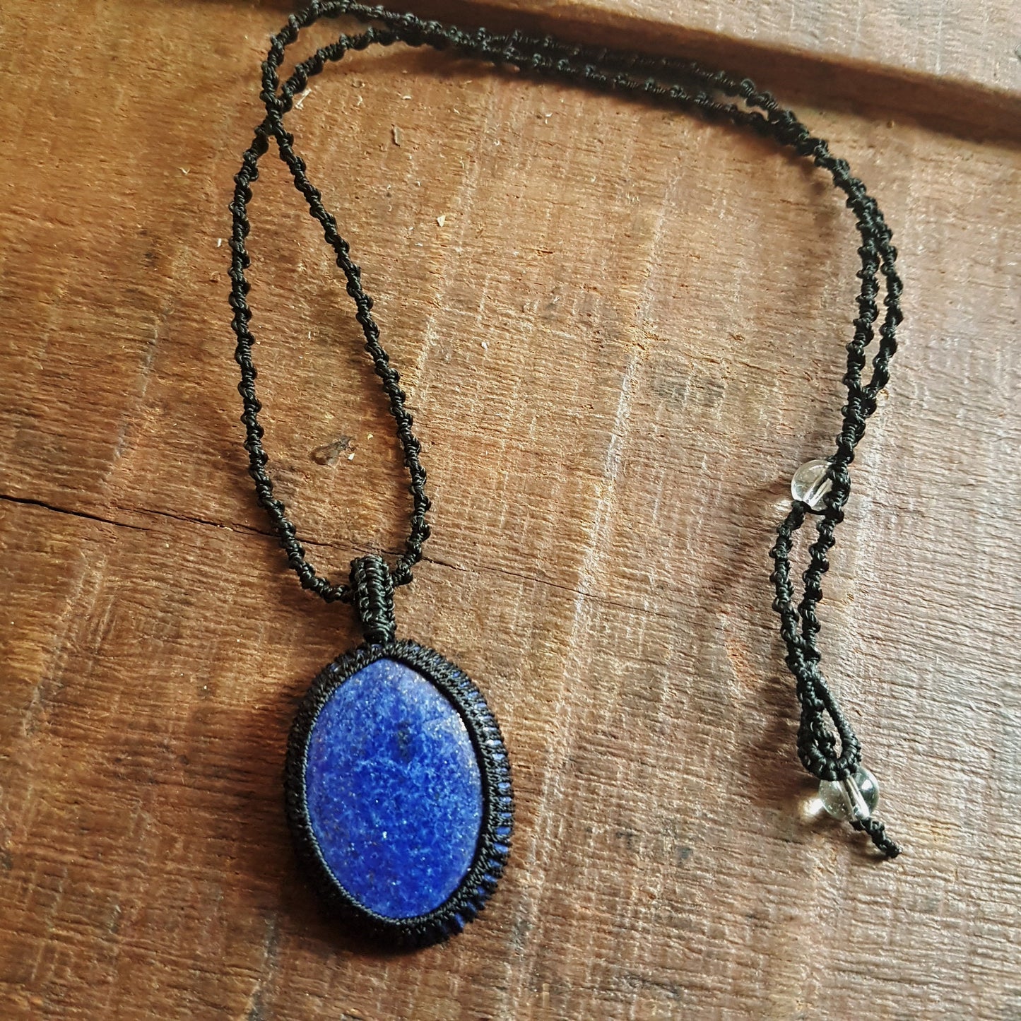 Gender neutral design lapis lazuli pendant necklace. Hangs on a 20 inch black woven corkscrew knot cord. Adjustable length. Unisex jewelry. - Vintage India Ca