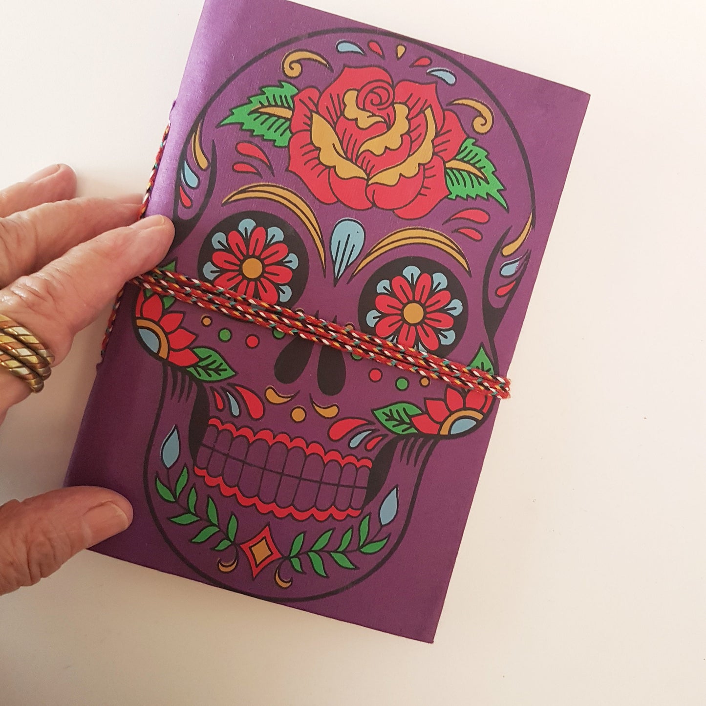 Purple skull sketchbook journal 5 by 7 inches with blank artisan paper pages. Colorful gothic day of the dead sugarskull design in purple. - Vintage India Ca