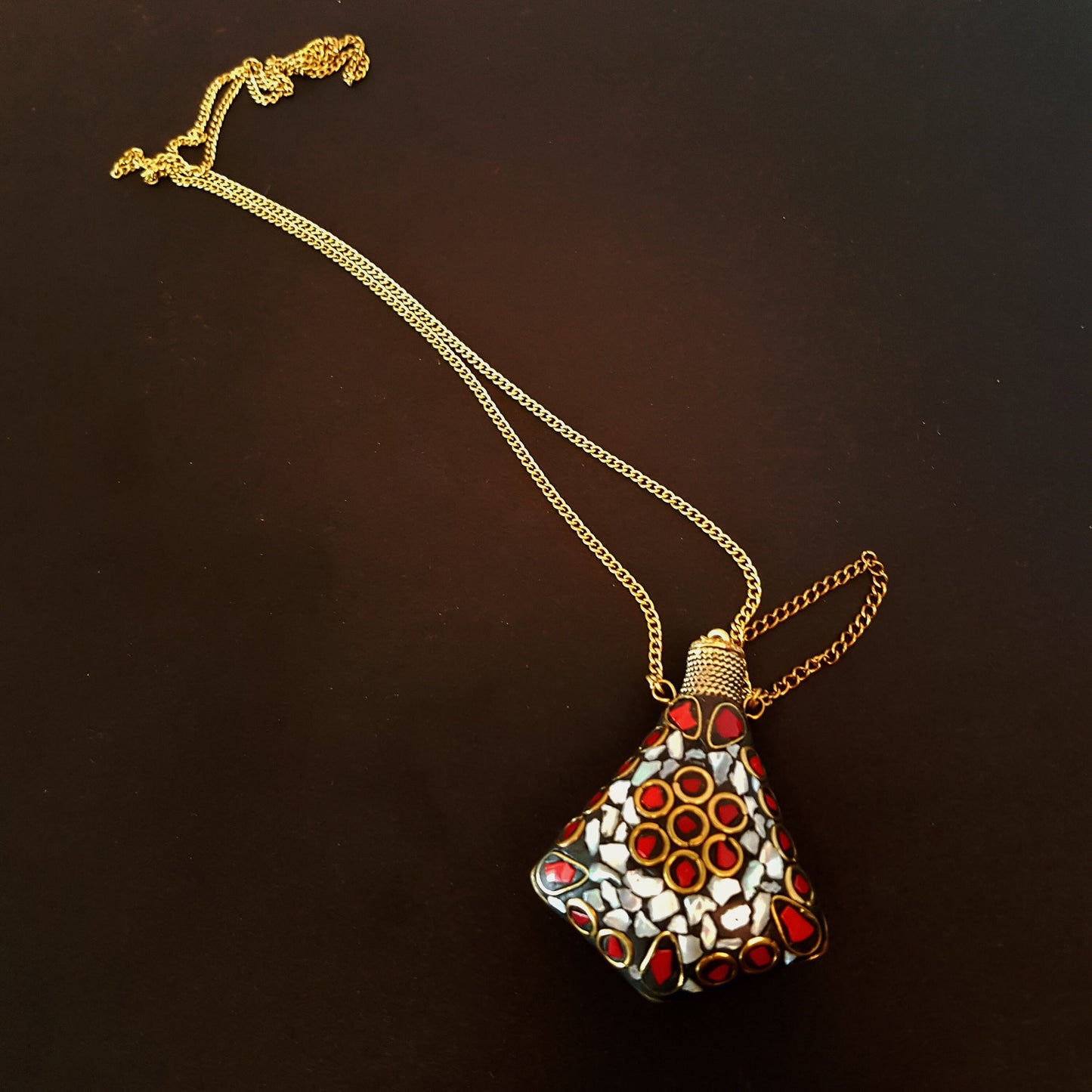 Perfume bottle pendant in a stone mosaic design. Inlaid withTibetan turquoise, lapis & MOP stones. Bottle closes with a brass wand stopper. - Vintage India Ca