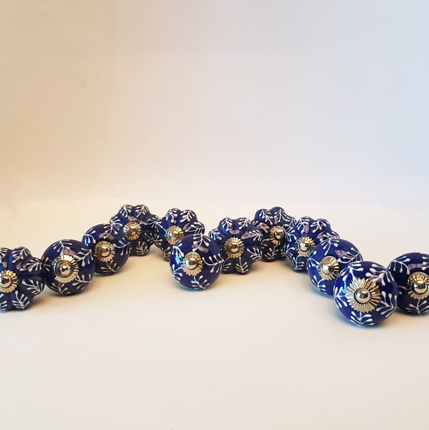 12 piece cabinet knob set. Delft cobalt blue and white drawer pulls. Each knob pull is hand painted and embossed in a botanical fern design. - Vintage India Ca