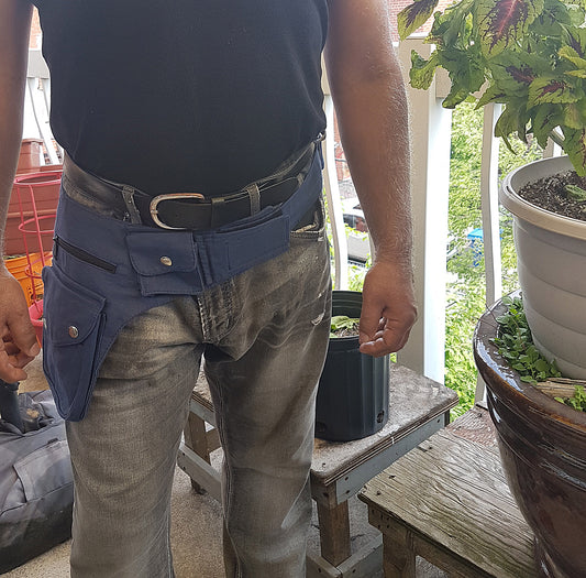 Utility festival belt in navy blue. Unisex travel & shopping money belt. Adjustable to 48 inches. 6 pockets-4 zip, 2 cargo . Handy coin pouch.