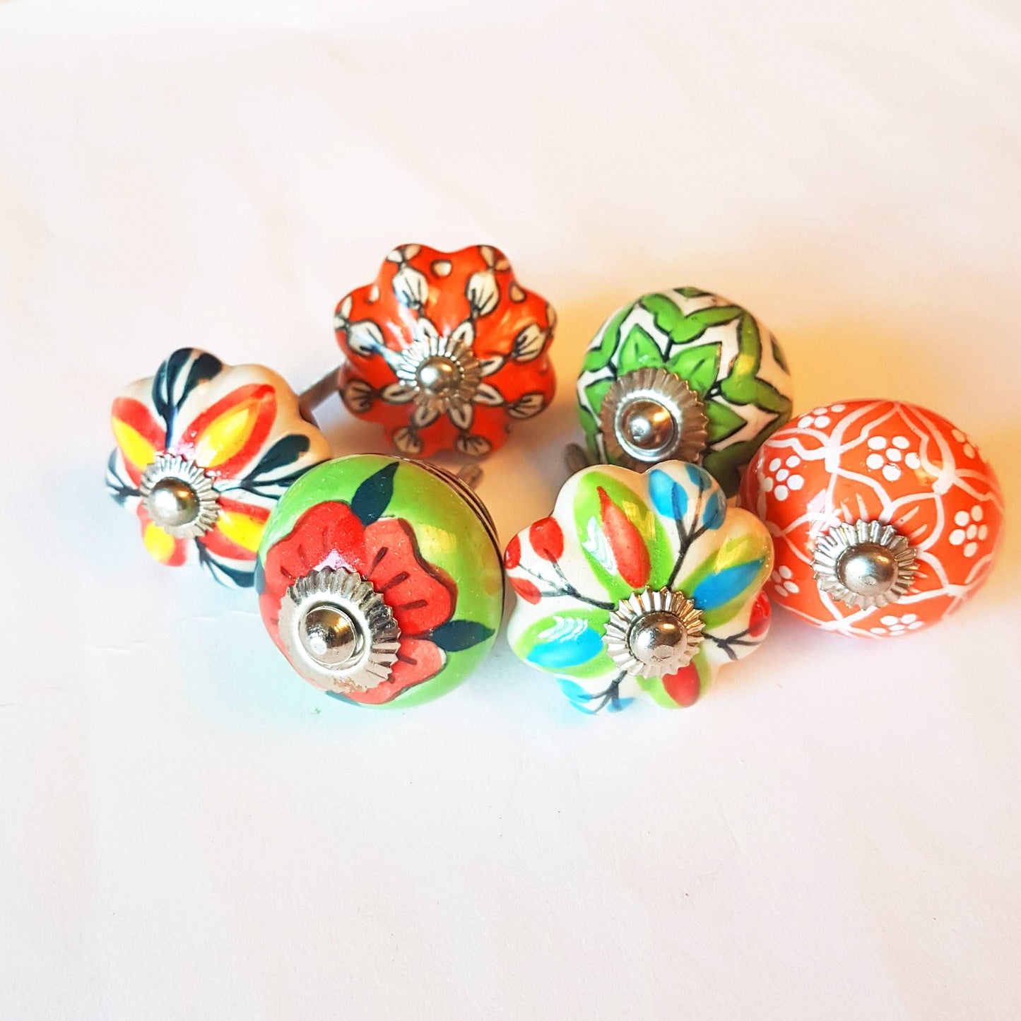 6 cabinet knobs Dolce exclusive collection. Hand painted floral ceramic art. Drawer pulls. one and one half inches in diameter