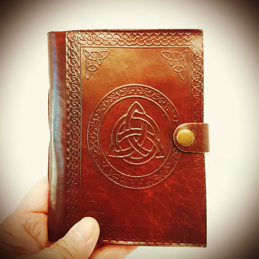 Leather bound journal with a hand embossed Celtic Triquetra cover.