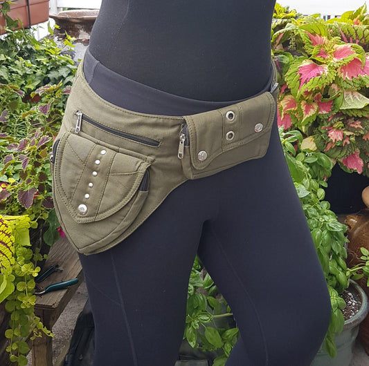 Utility festival pocket belt in army green. Adjusts to 48 inches. Unisex design waist-hip-bum bag. Use as travel & shopping money belt. 4 zip pockets. Adjustable to 48 inches.