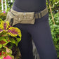 Utility festival pocket belt in army green. Adjusts to 48 inches. Unisex design waist-hip-bum bag. Use as travel & shopping money belt. 4 zip pockets. Adjustable to 48 inches.