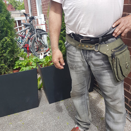 Utility festival belt. Unisex design army green waist-hip-bum bag. Convertible as cross body shoulder bag. 5 pockets- 3 zip. Adjustable to 48 inches.