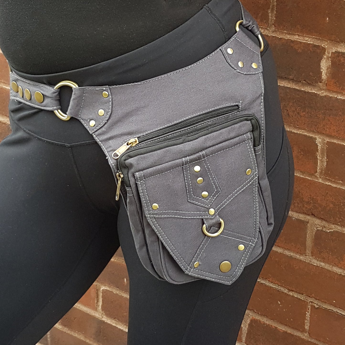 Utility festival belt. Unisex design gray waist-hip-bum bag. Convertible as cross body shoulder bag. 5 pockets- 3 zip. Adjustable to 48 inches.