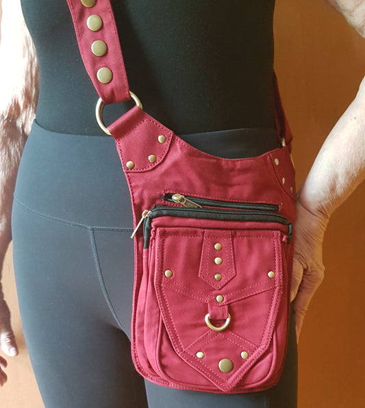 Utility festival belt. Unisex design maroon waist-hip-bum bag. Convertible as cross body shoulder bag. 5 pockets- 3 zip. Adjustable to 48 inches.