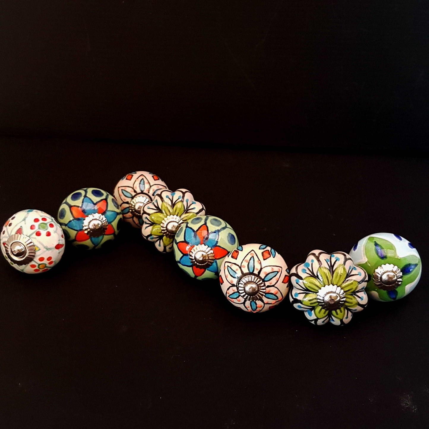 8 hand painted drawer pull cupboard knobs. Exclusive hand painted 8 piece set in blue, green & white floral patterns with silver centers.