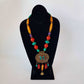 Bohemian designer necklace with turquoise & copal beads. Vintage design embossed bronze metal pendant. Impressive colorful piece.