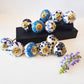 12 Delft blue & white cabinet knob drawer pulls with gold tone metal.