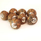 8 cabinet knobs hand painted in rustic country designs. Black & brown floral patterns with silver hardware. Easy and affordable DIY decor.