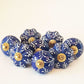 8 Delft cabinet knob drawer pulls in cobalt blue & white hand painted embossed designs. Exclusive Regal Gold  8 piece decorator collection.