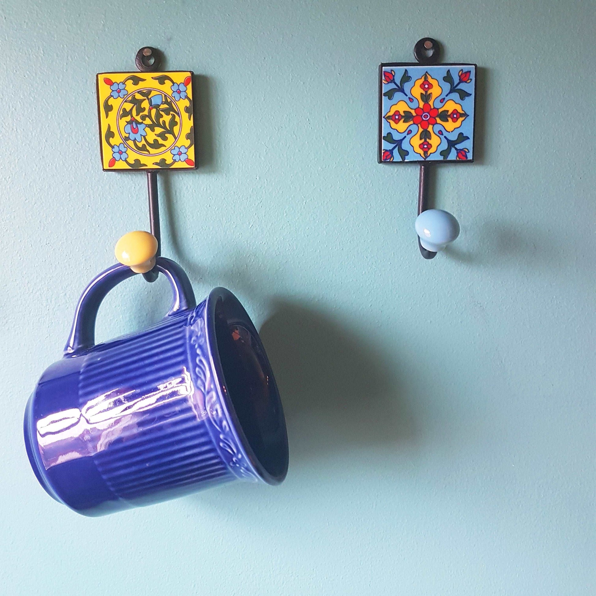 3 Coat hooks-wall hooks.  Azura collection of 3 hand painted ceramic hooks in exclusive designs . 4.5 by 2 inch. Great House warming gifts.