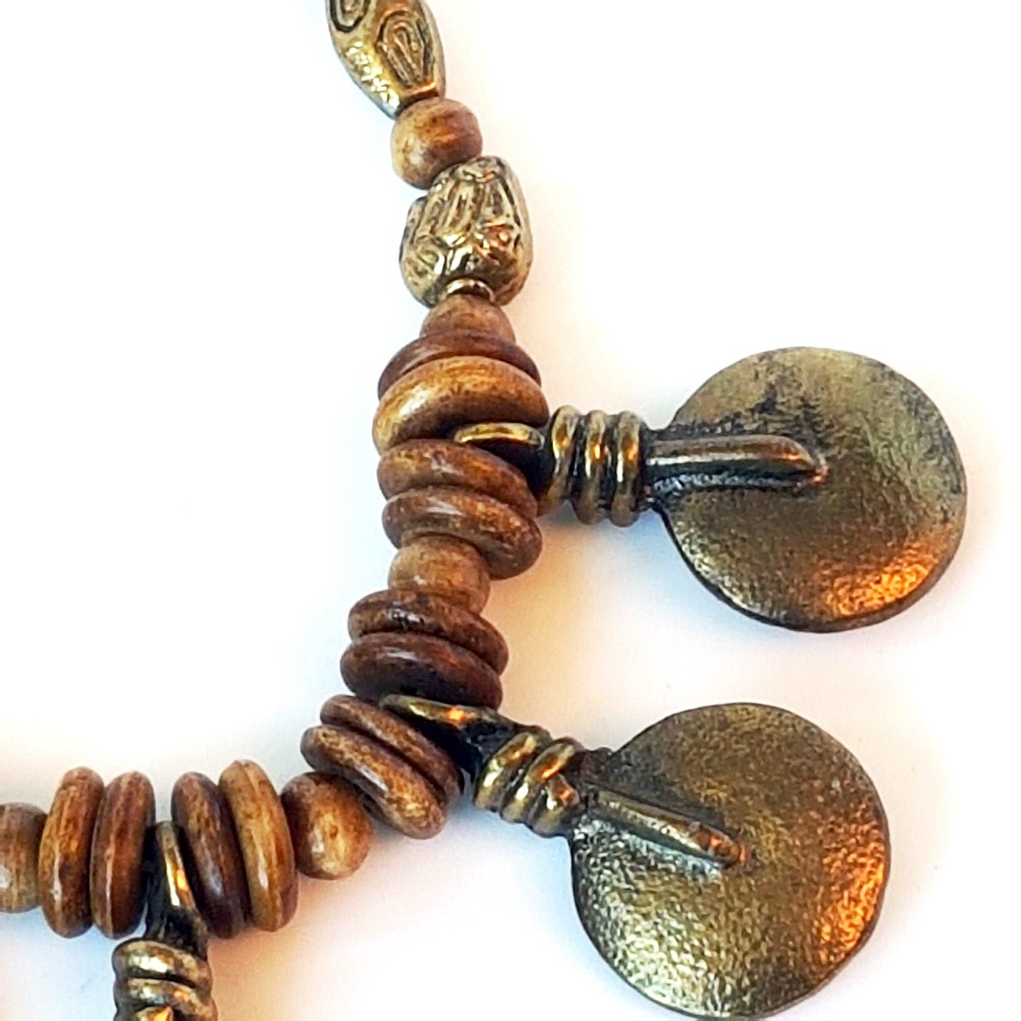 Bronze metal disc pendant necklace with rustic handmade beads.  Classic old world tribal design 19 inches long. Versatile casual to dressy.