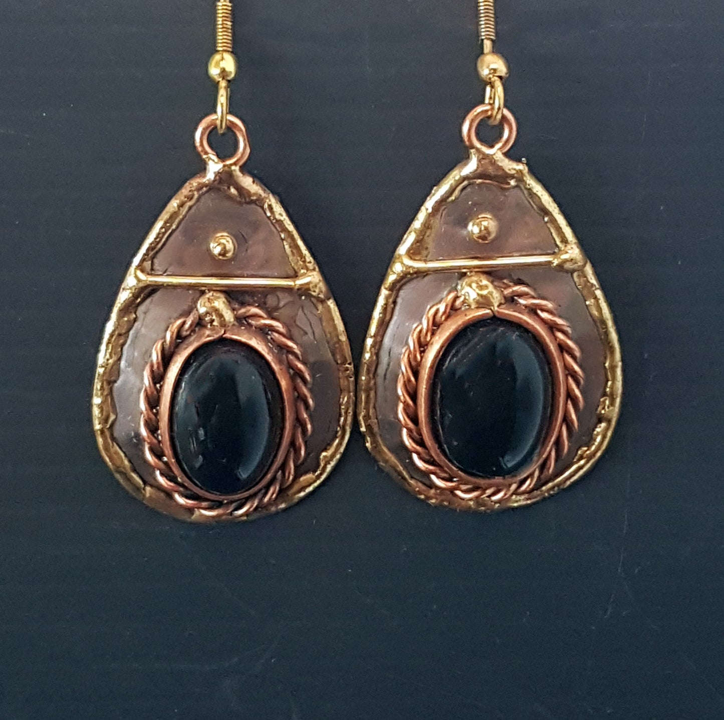 Silver & mixed metal tear drop shape earrings with black onyx oval stones. Hand crafted design in brass, copper and silver.
