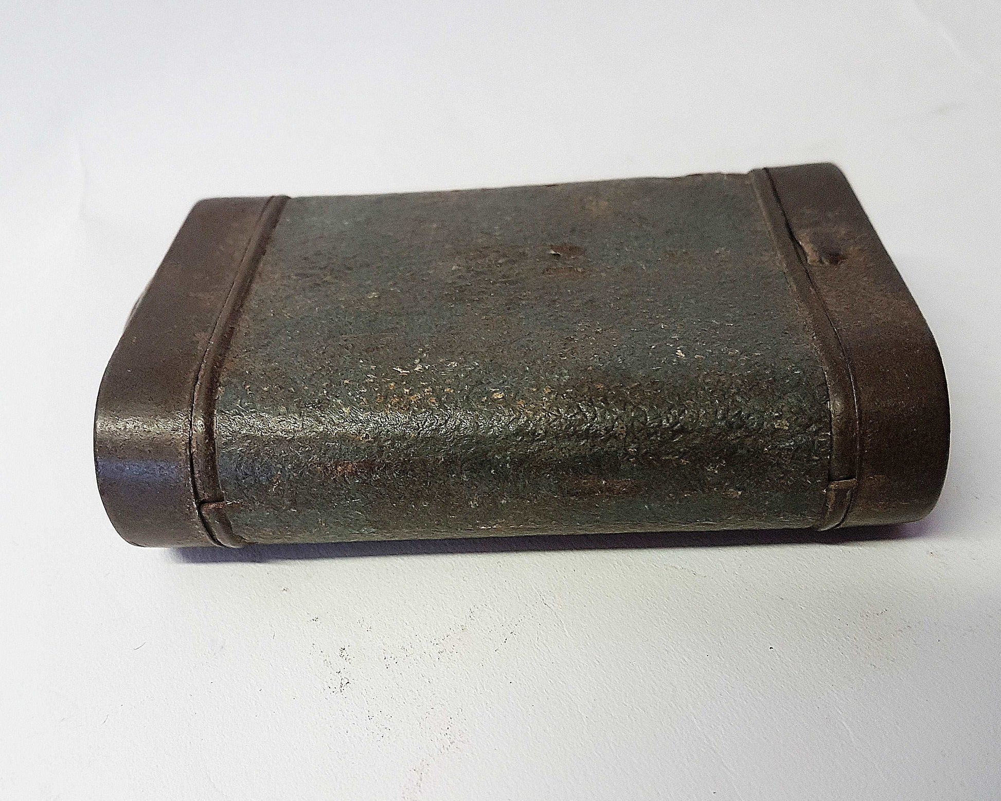 Antique vintage metal flashlight. Green leather pocket torch. 4 inches high by 2.75 inches wide. Not in working order. Rare collectible.