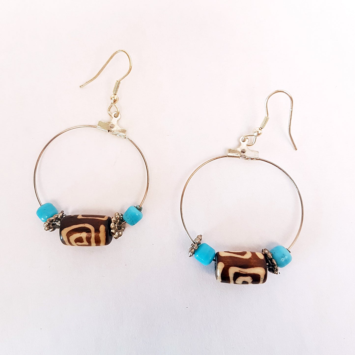 Silver hoop earrings with Dzi bead & small turquoise stones.