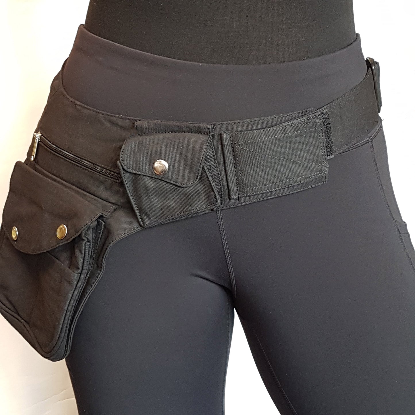 Black Utility Pocket Hip Belt. Adjusts to 48 inches. 6 pocket design.