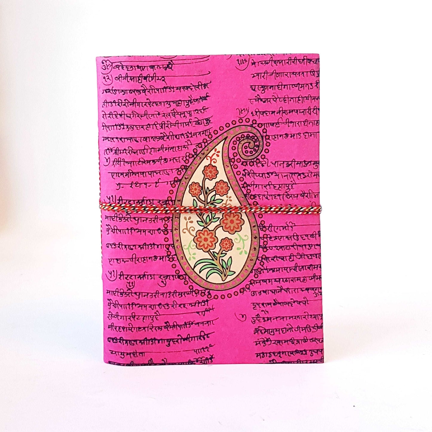 Blank notebook with fushia pink floral paisley design cover 6x8 inch. Use as sketchbook, bullet journal, diary. Premium handmade paper.