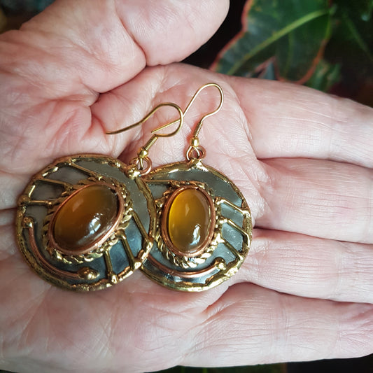 Spectacular disc shaped silver & mixed metal earrings with oval golden agate stones. These are statement earrings with a 2 inch vertical hang.
