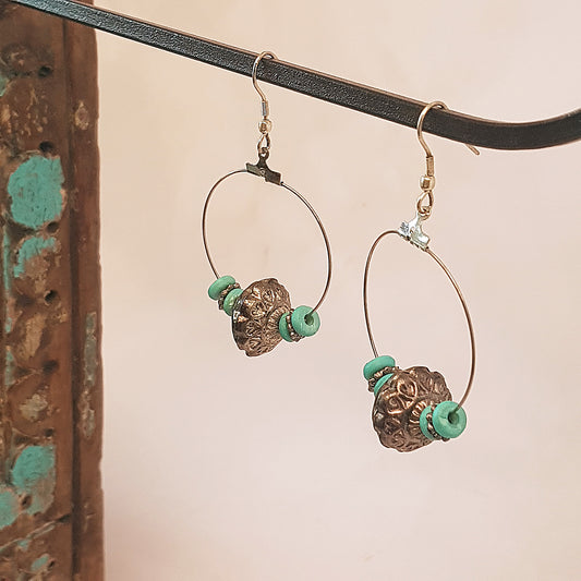 Silver hoop earrings with antique design silver & turquoise beads.