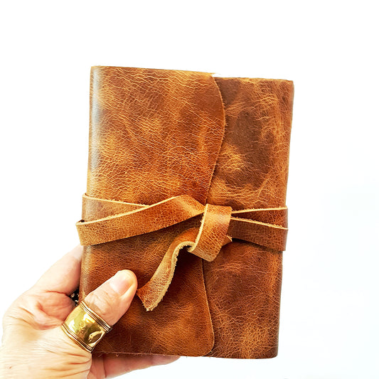 Leather bound journal with strap. Caramel nubuck leather western cowboy diary 5 by 7 inches