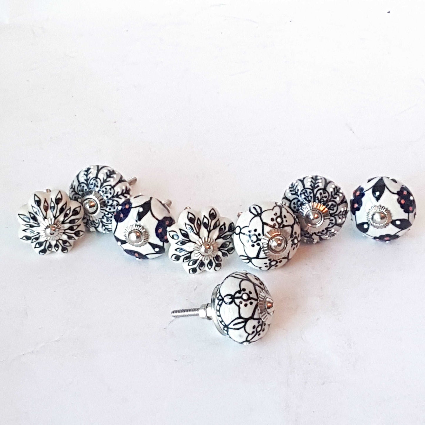 Andromeda set of 8 hand painted cabinet drawer knobs with botanical patterns in black & white.  Exclusive designer collection. In stock now!