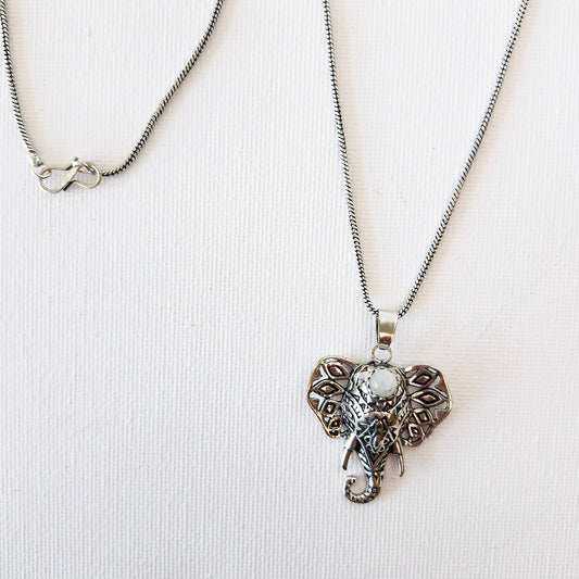 Silver elephant pendant with an inlaid moonstone. Symbol of Ganesha-remover of obstacles.