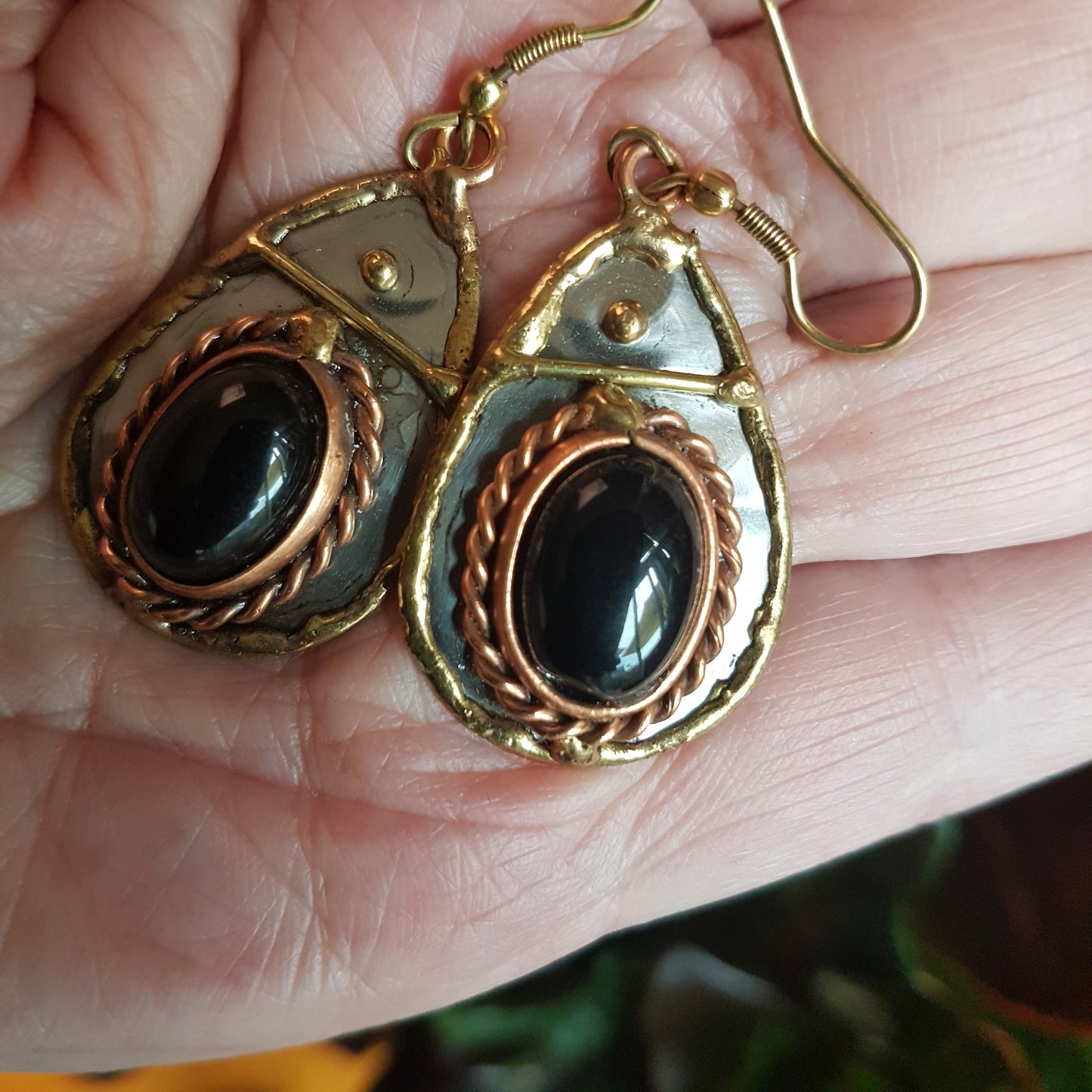 Silver & mixed metal tear drop shape earrings with black onyx oval stones. Hand crafted design in brass, copper and silver.